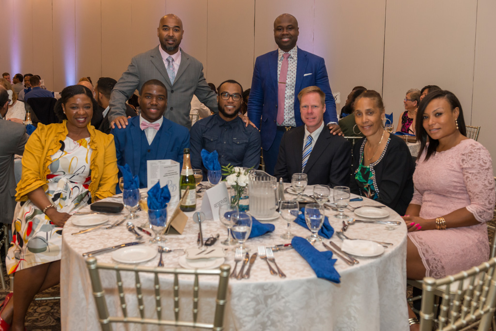 Guests at past gala dinner table