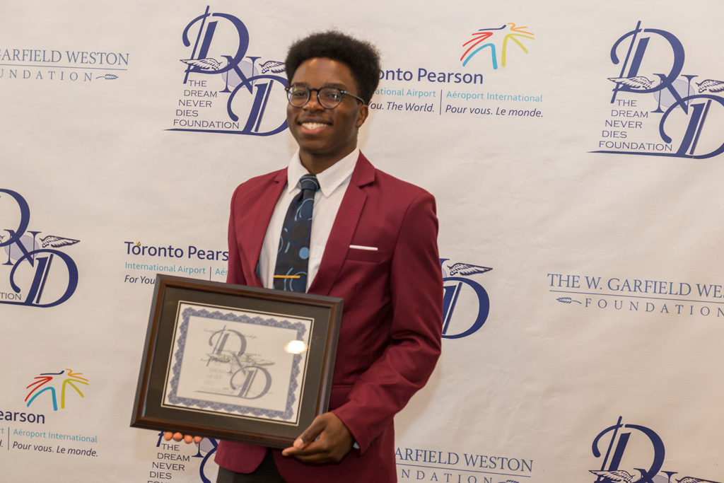 Scholarship recipient with certificate